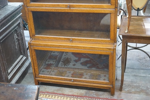 An early 20th century Globe Wernicke style oak four section glazed bookcase, width 87cm, depth 32cm, height 179cm